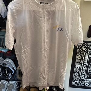 Uniqlo White kaws x andy Warhol banana tee. Never worn. Washed and dried. Men L
